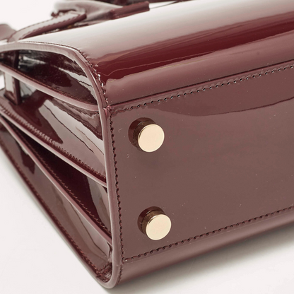 YVES SAINT LAURENT SAC DE JOUR NANO EN CUIR VERNI