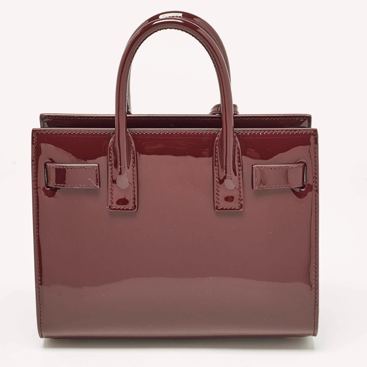 YVES SAINT LAURENT SAC DE JOUR NANO EN CUIR VERNI